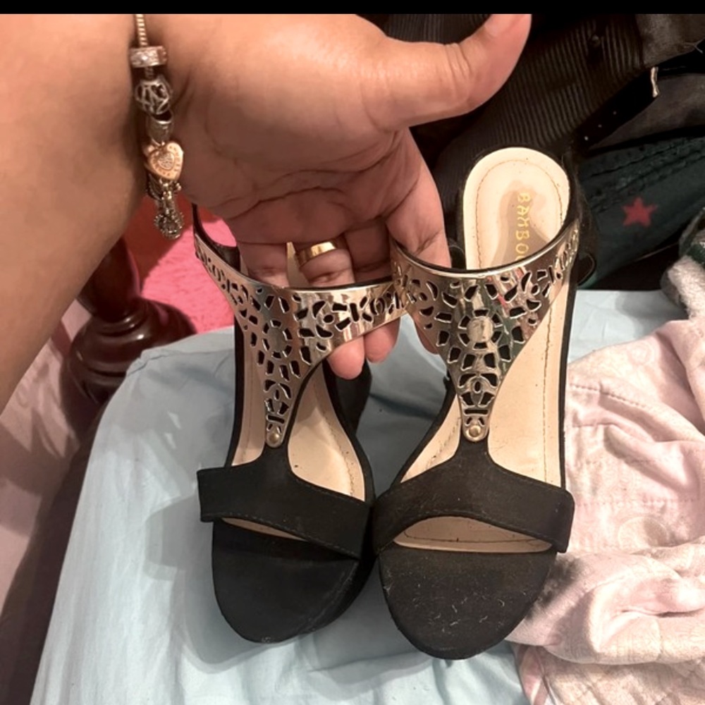Black platform heels with gold detailing